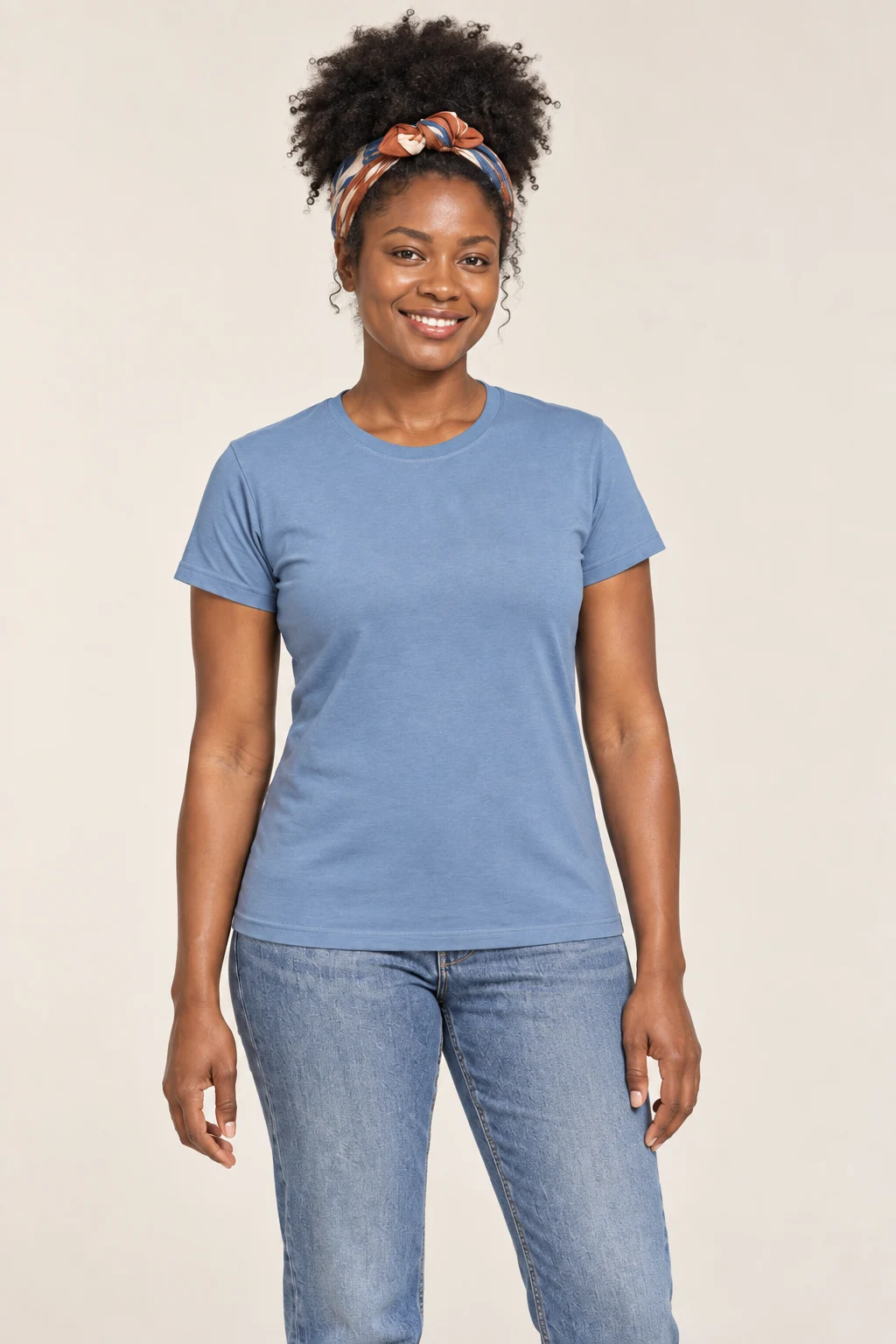 A model wearing a blue Gildan 64000 softstyle tee, front view