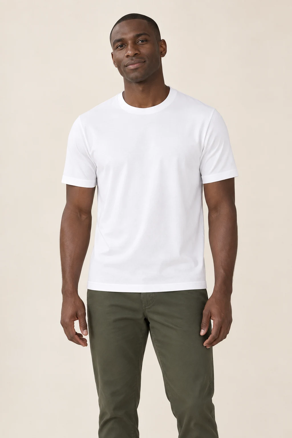A model wearing a white 100% polyester tee, front view